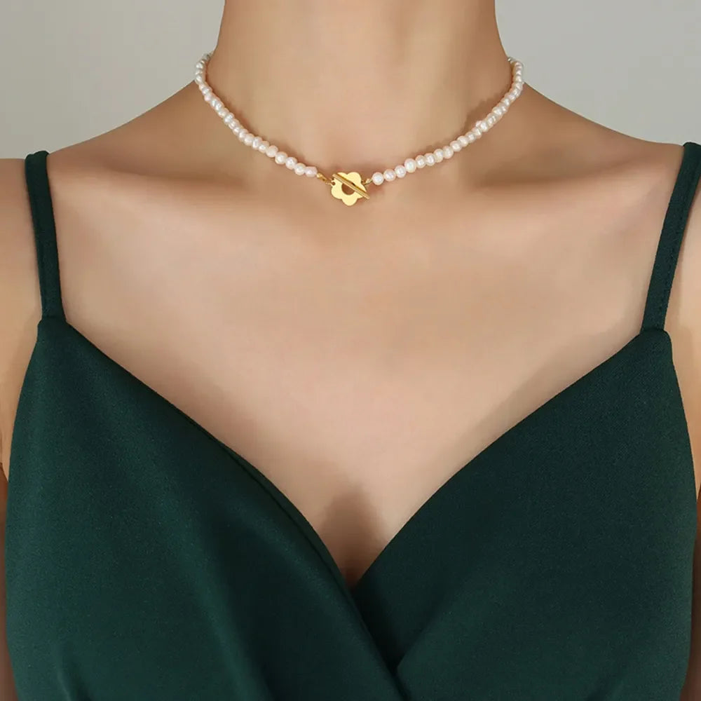 Freshwater pearl necklace with gold floral clasp
