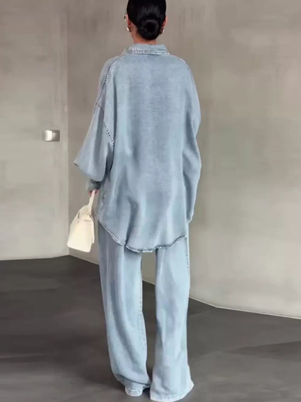 light blue shirt and pants set with tunic-length top, full-length pants and button-front