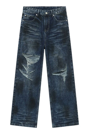 Dark wash distressed denim jeans with ripped details and a relaxed fit.