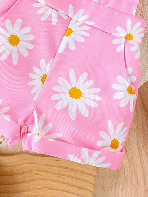 Pink daisy print baby overalls with cuffed hems