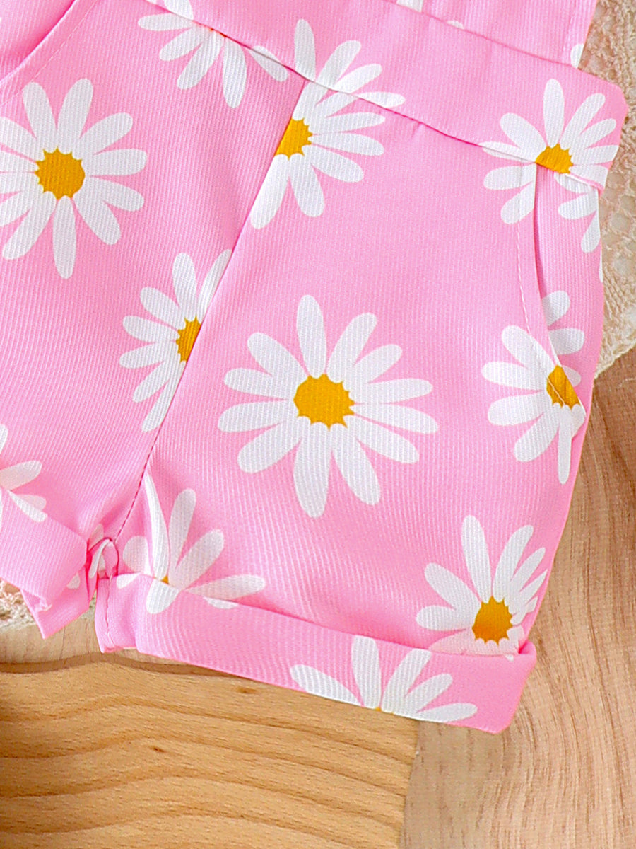 Pink daisy print baby overalls with cuffed hems