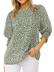 Green animal print blouse with half sleeves and smocked cuffs.
