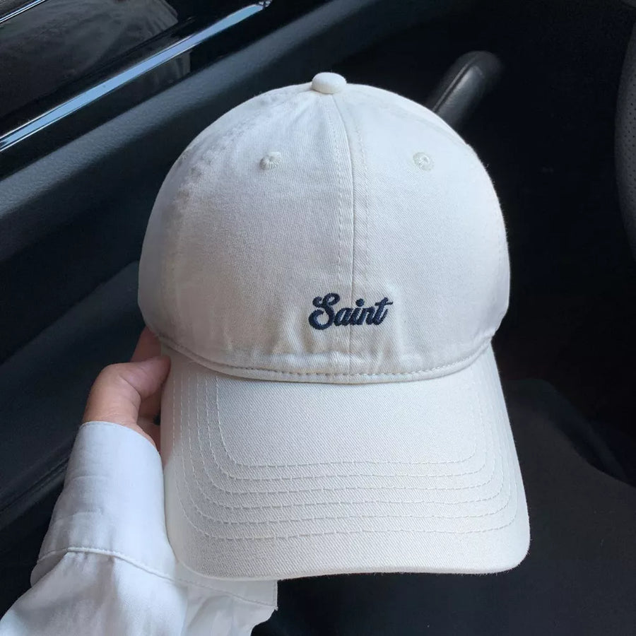 Off-white cotton baseball cap with embroidered script detail