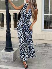 Sleeveless leopard print romper with V-neck and belted waist, in blue and black animal print.