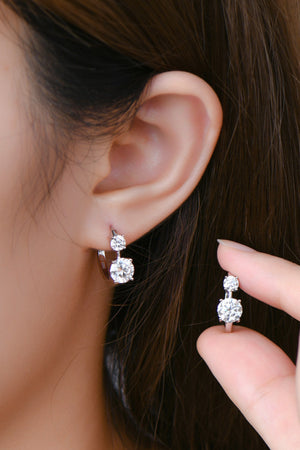 Silver double stone huggie hoop earrings with two sparkling cubic zirconia stones.