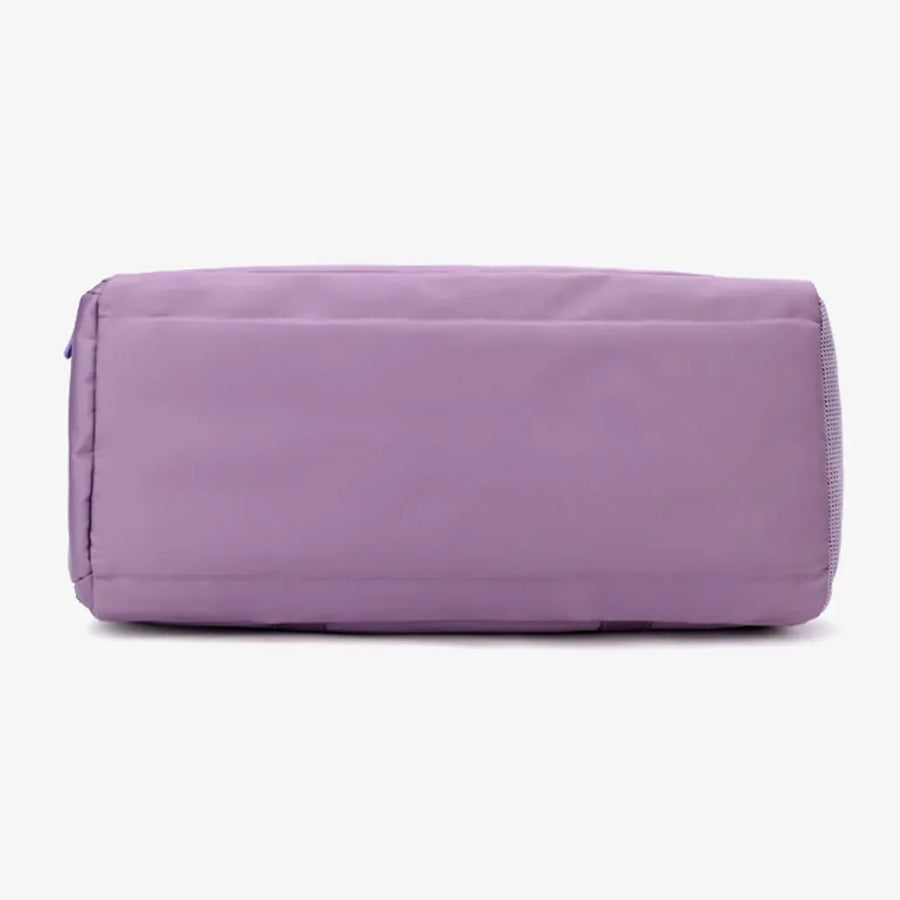 Mauve nylon duffle bag with mesh pocket detail on the side.