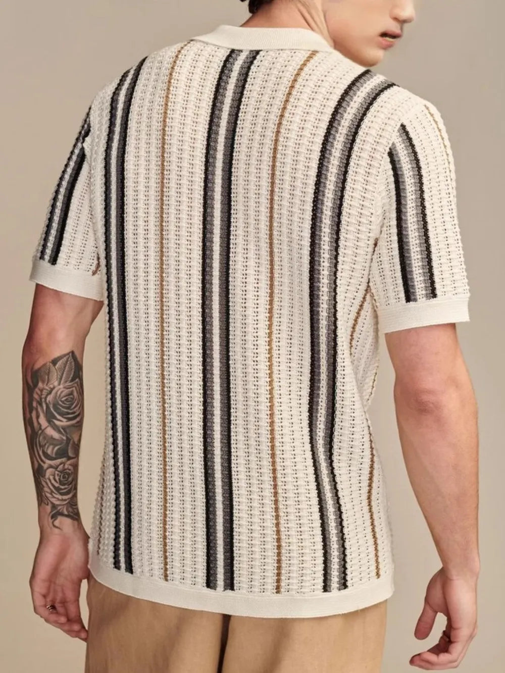 Textured knit polo shirt with vertical stripes in beige, black, and brown.