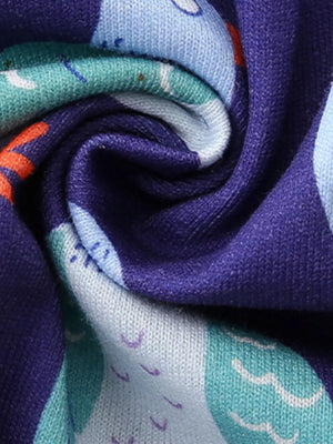 Toddler dress in cotton with a playful pigeon print in blue, teal, and orange on a purple background.