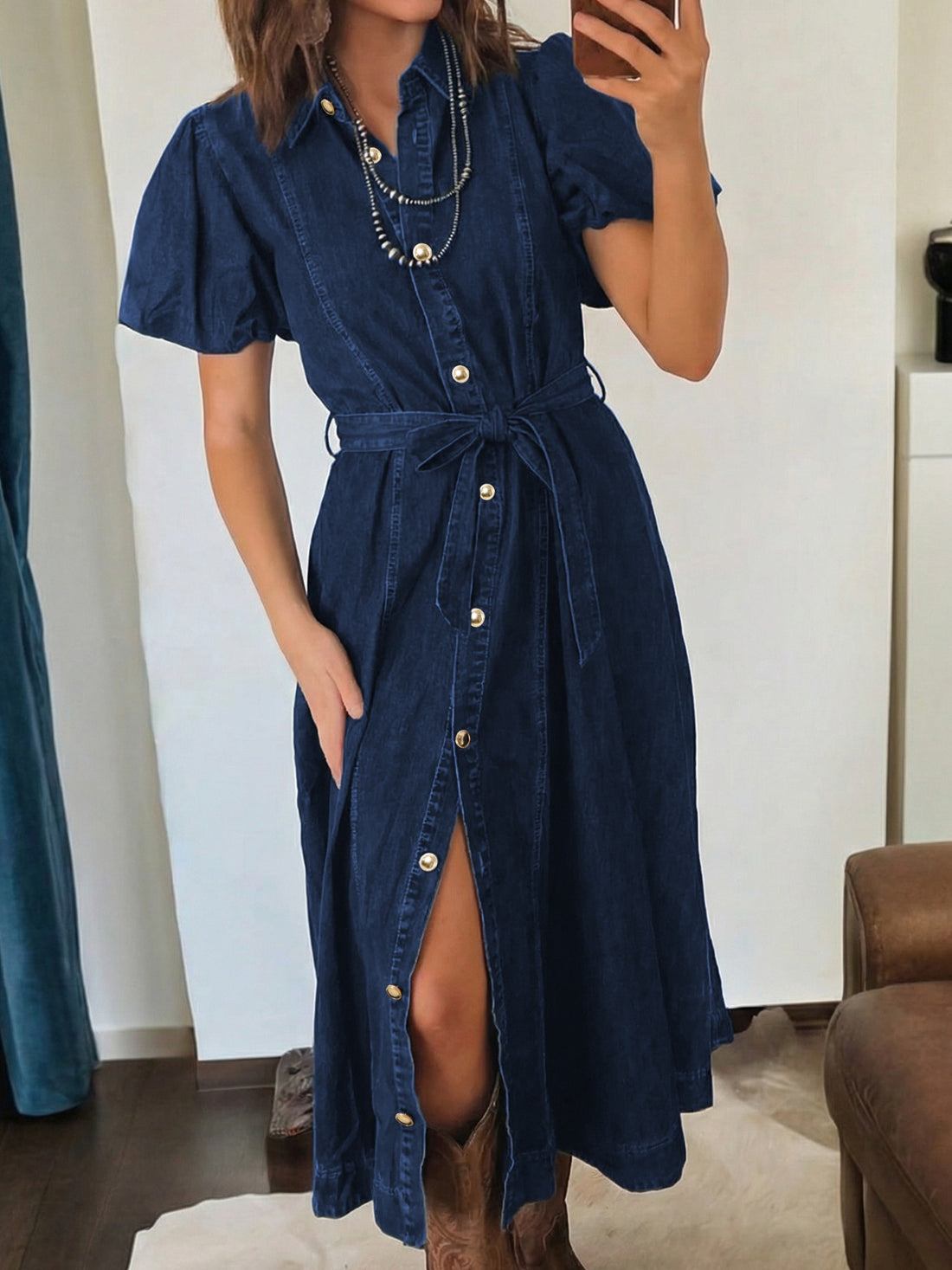 Button-down midi denim dress with puff sleeves, belt, and gold buttons.