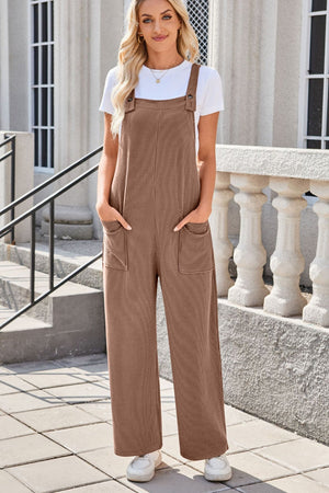 Caramel striped denim overalls with patch pockets and wide legs.