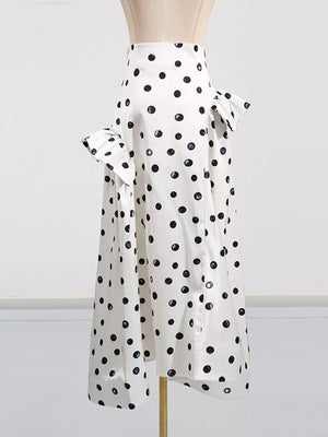 White polka dot midi dress with ruffled sleeves and a high waist.