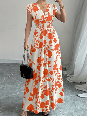 Maxi dress with orange floral print, V-neck, cap sleeves, and smocked waist.