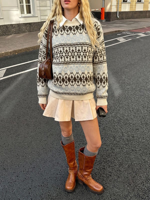 light blue pullover sweater with ribbed cuffs and long sleeve
