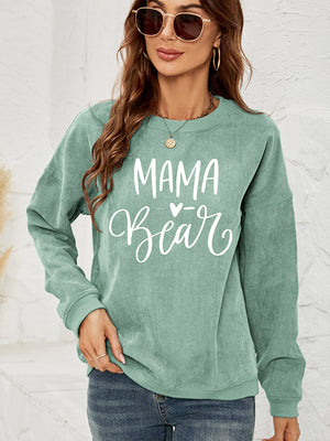 Textured corduroy sweatshirt in Gum Leaf green with white "Mama Bear" graphic print.