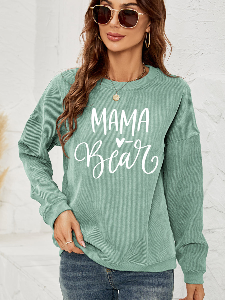 Textured corduroy sweatshirt in Gum Leaf green with white "Mama Bear" graphic print.
