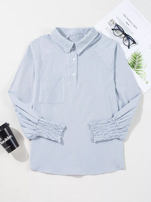 Blue and white striped long sleeve shirt with a collar, button placket, chest pocket, and ruched cuffs.