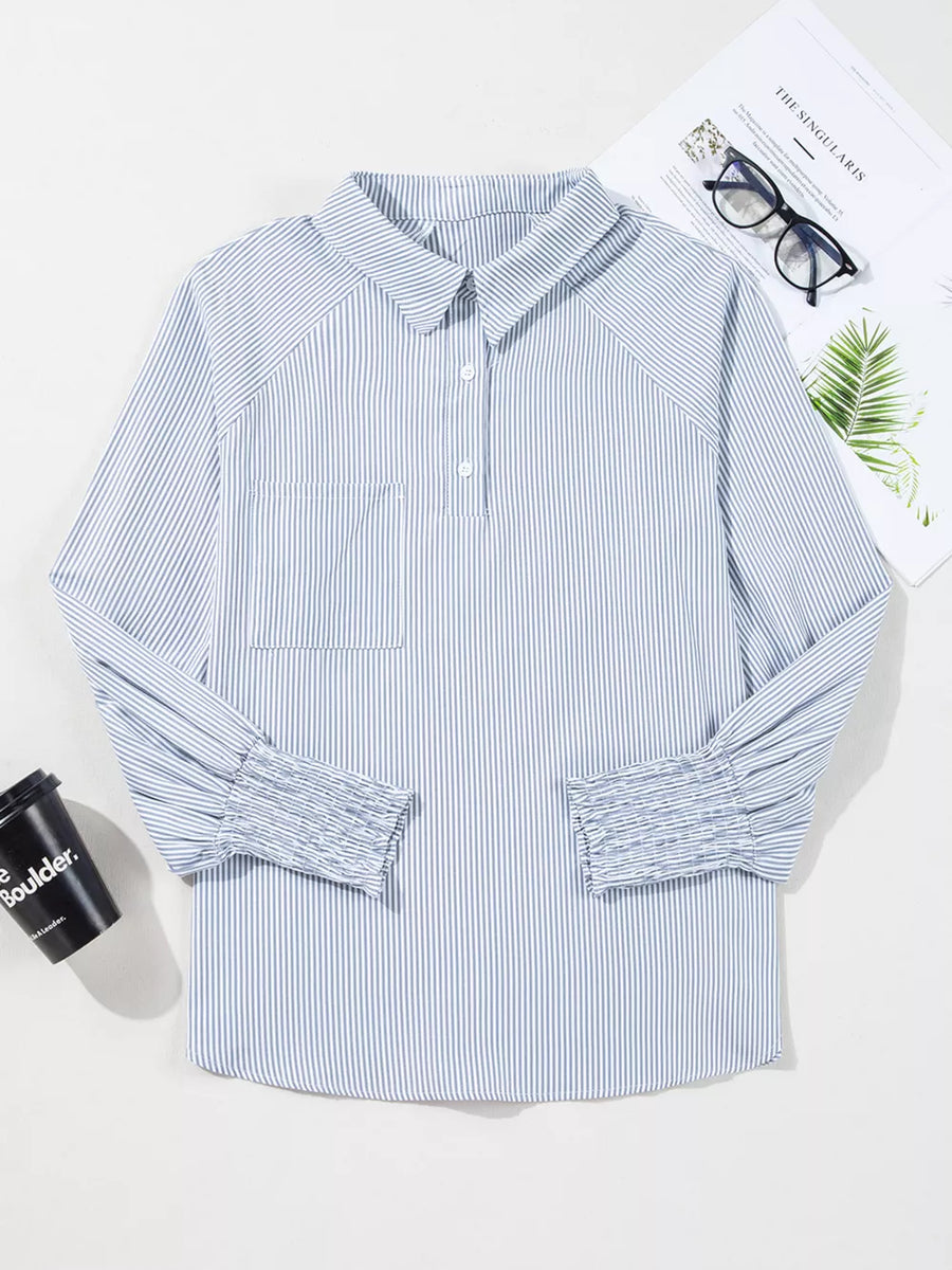 Blue and white striped long sleeve shirt with a collar, button placket, chest pocket, and ruched cuffs.