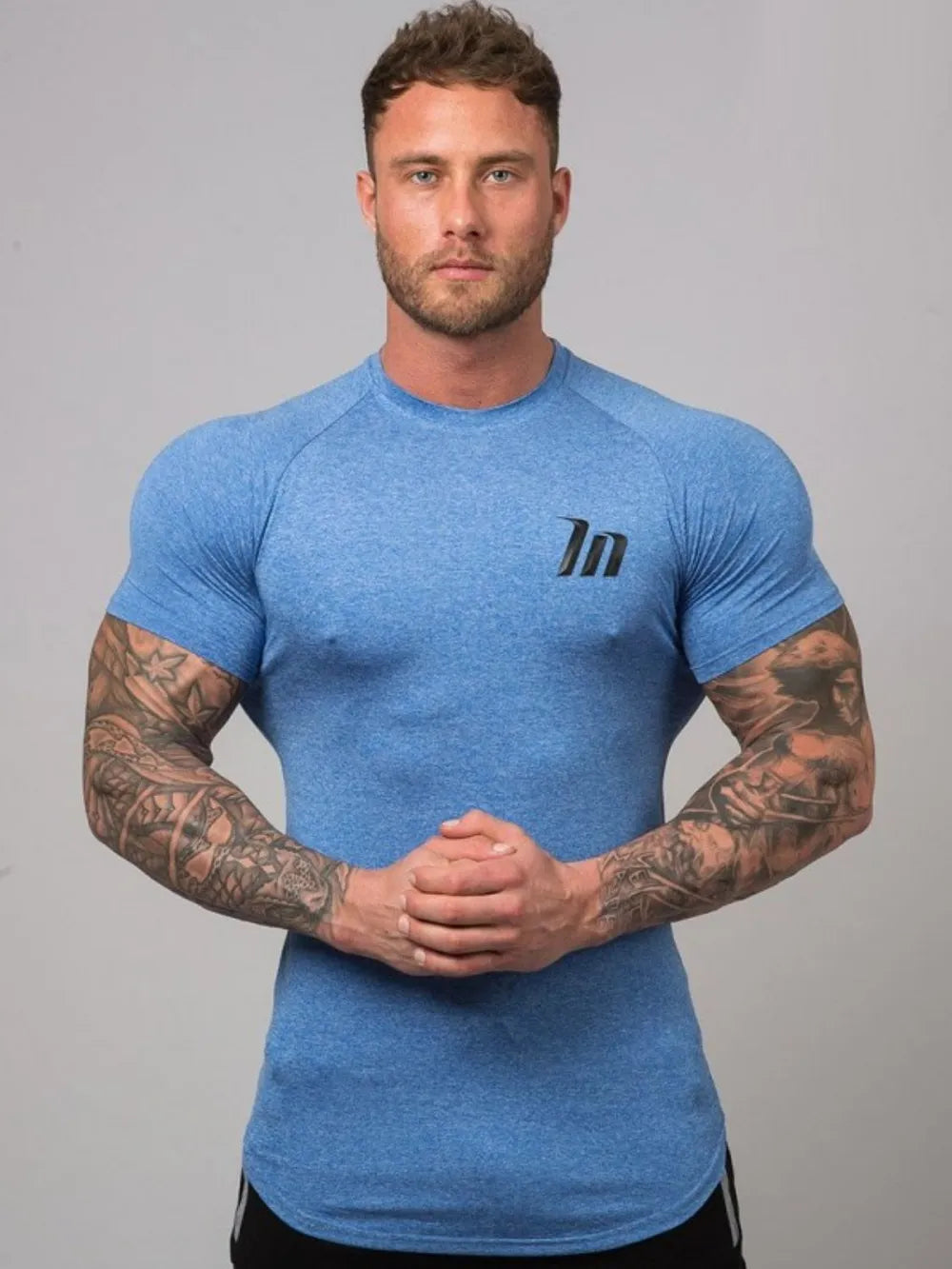 Sky Blue performance fit raglan tee with black logo and short sleeves.