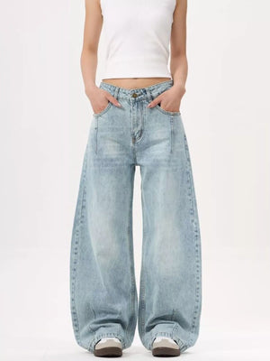 Men's light blue wide-leg stretch jeans with a relaxed fit.