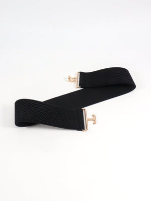 Black elastic belt with sculpted gold buckle detail