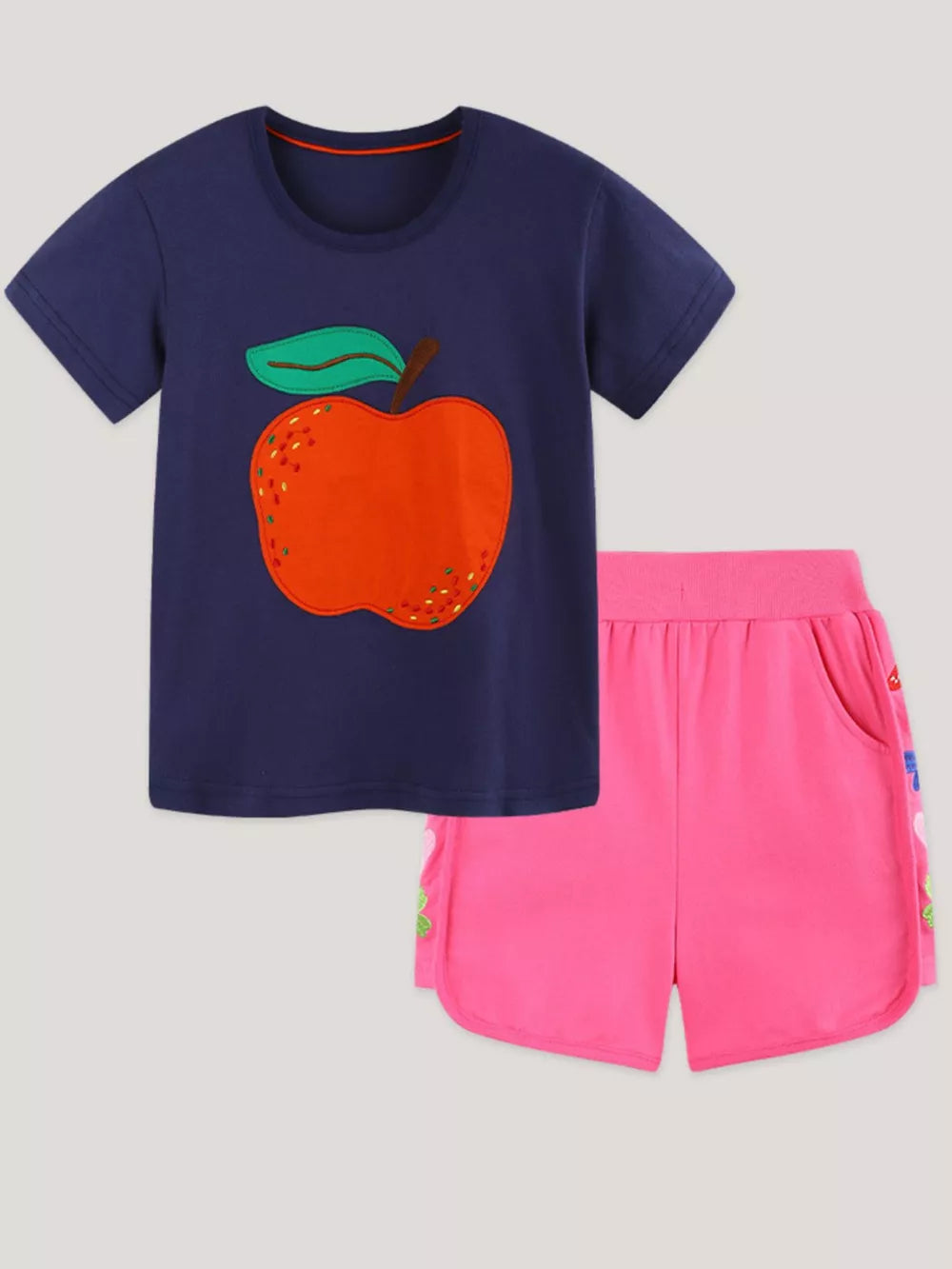 Navy t-shirt with apple appliqué and pink shorts set for toddlers.