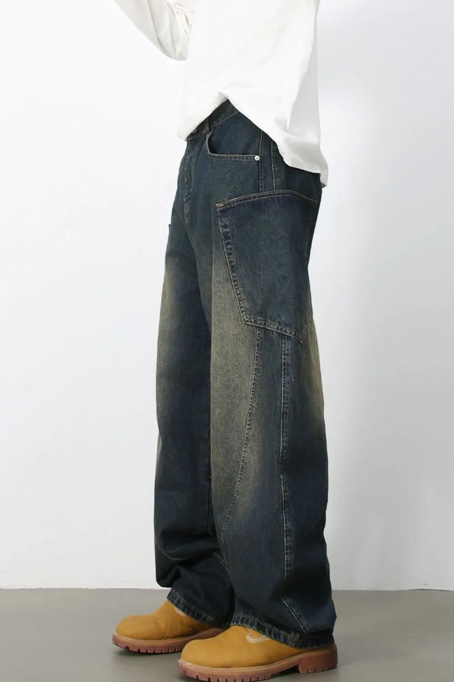Sculpted denim balloon trousers in dark wash with a relaxed fit and unique paneling.