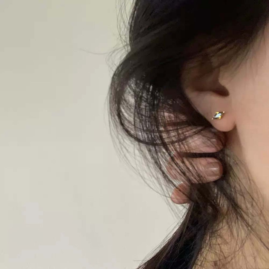 light green earrings featuring gold-plated and geometric