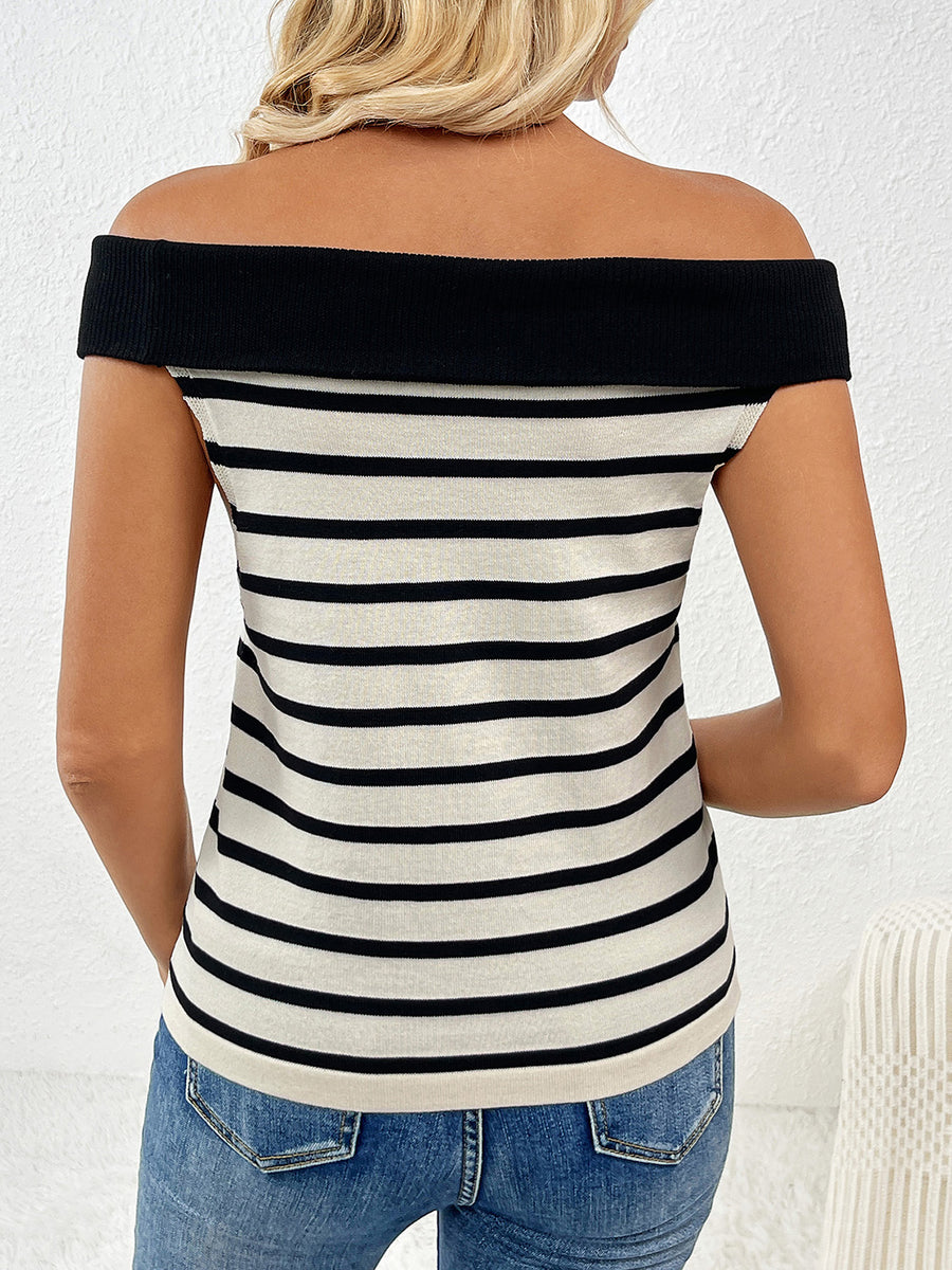 Off-shoulder knit top with black and white stripes and a black neckline.