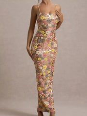 Maxi dress with floral sequin embellishments, spaghetti straps, and a bodycon fit.