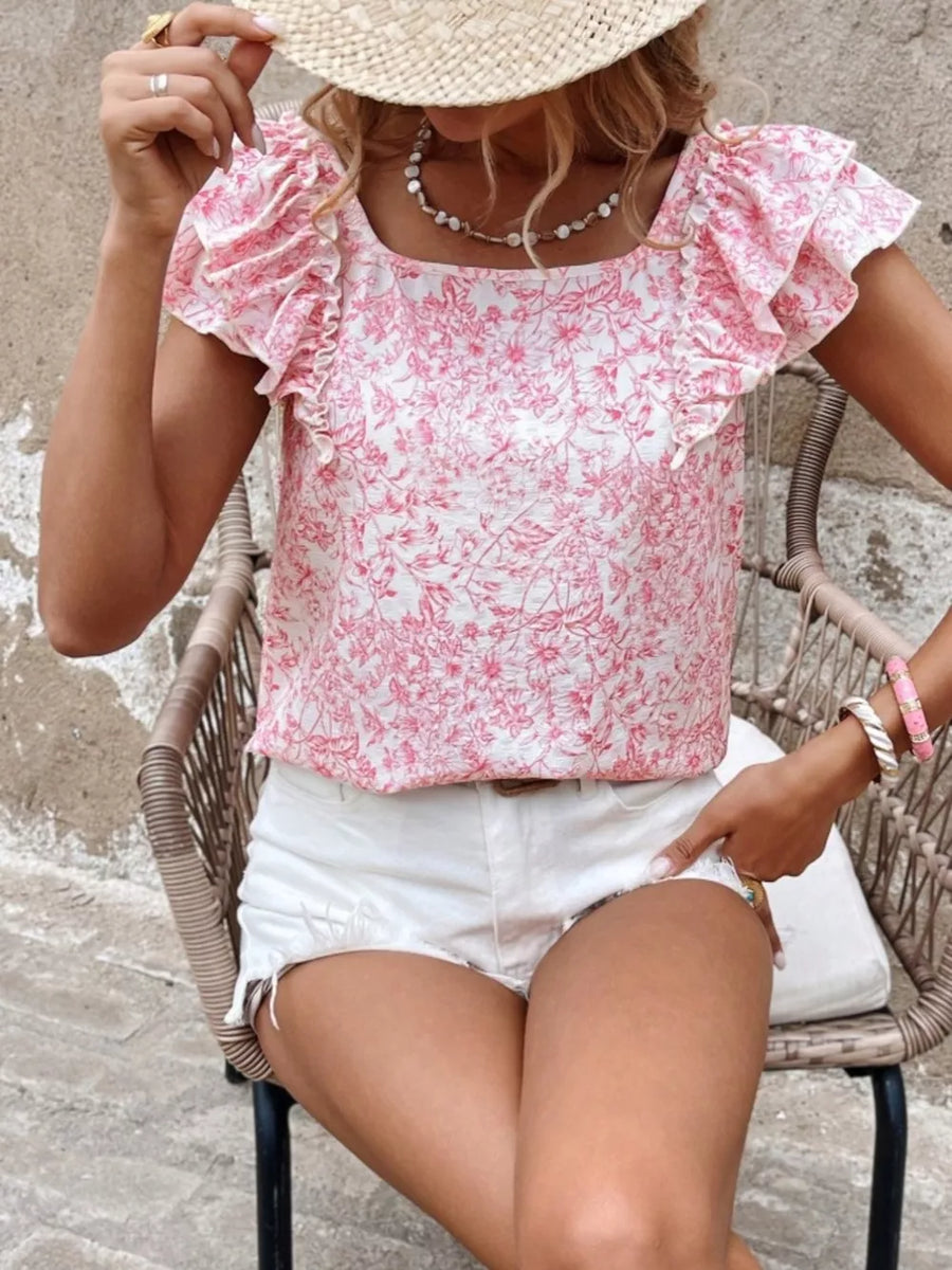 Pink floral ruffle blouse with square neckline and short sleeves.