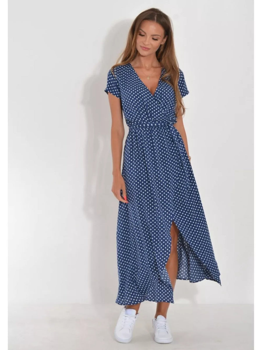 Blue polka dot wrap maxi dress with short sleeves and a high slit.