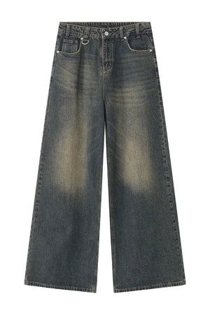 Faded wash palazzo denim trousers in dark blue with a wide leg and distressed details.