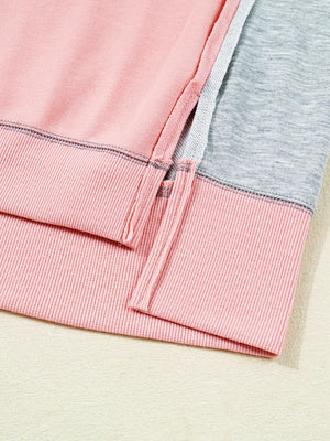 Oversized Dusty Pink sweatshirt with contrast stitching and side slits.