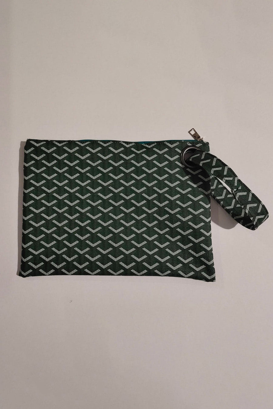 Army green clutch bag with geometric pattern and wrist strap
