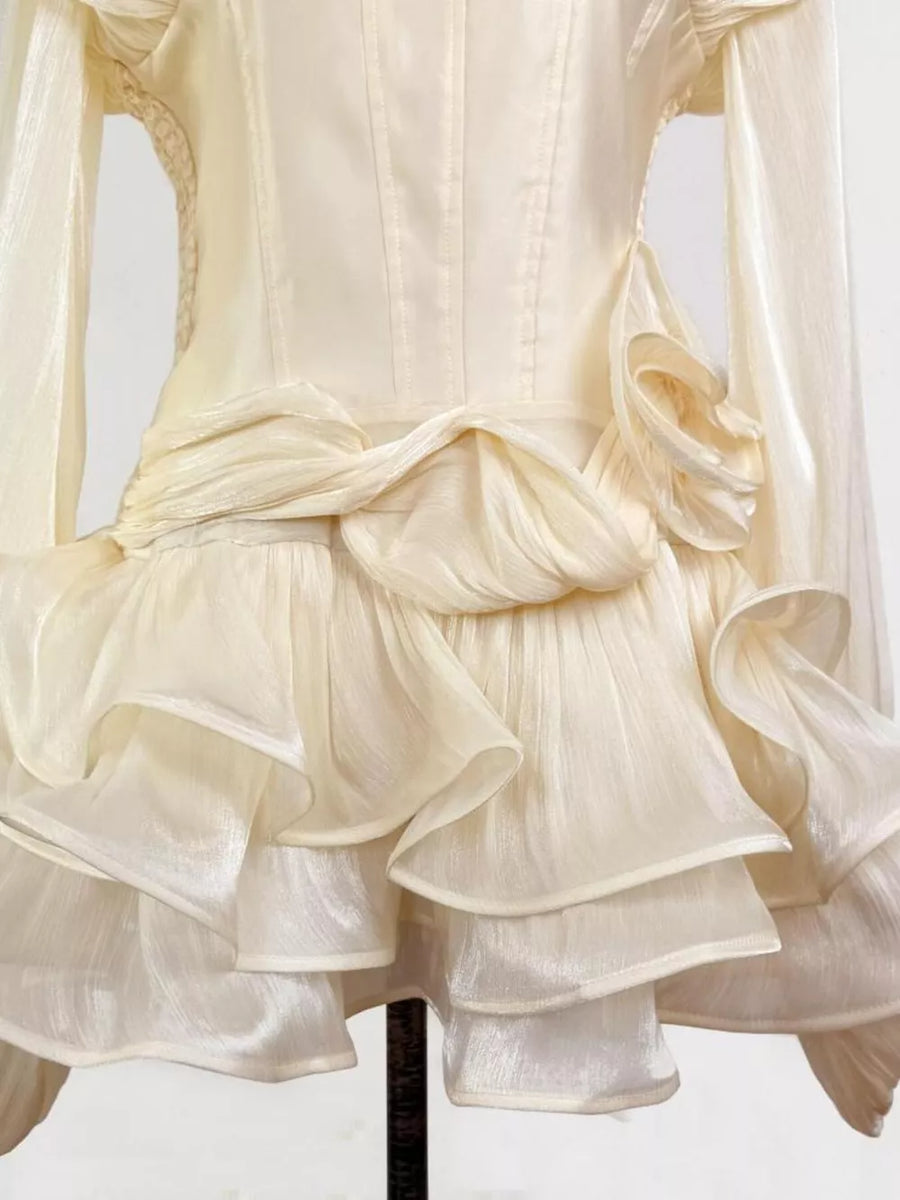 Elegant white ruffled mini dress with corset waist and long sleeves.