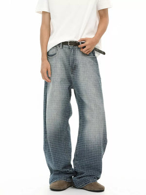 Men's relaxed-fit jeans in blue denim with a subtle grid pattern and buttoned waist.