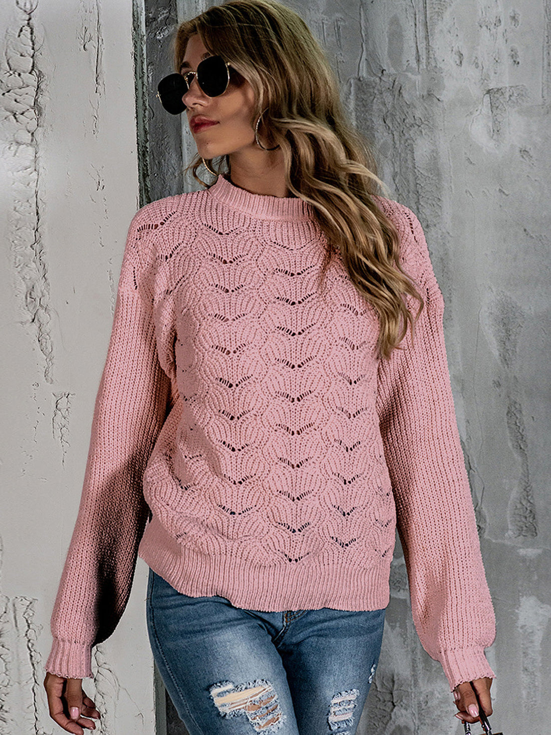 Blush pink openwork knit crew neck pullover sweater with balloon sleeves.
