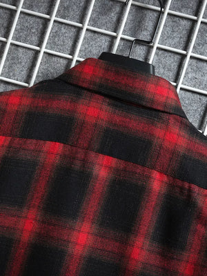 Red and black plaid short-sleeve cotton shirt, detail of collar and shoulder.