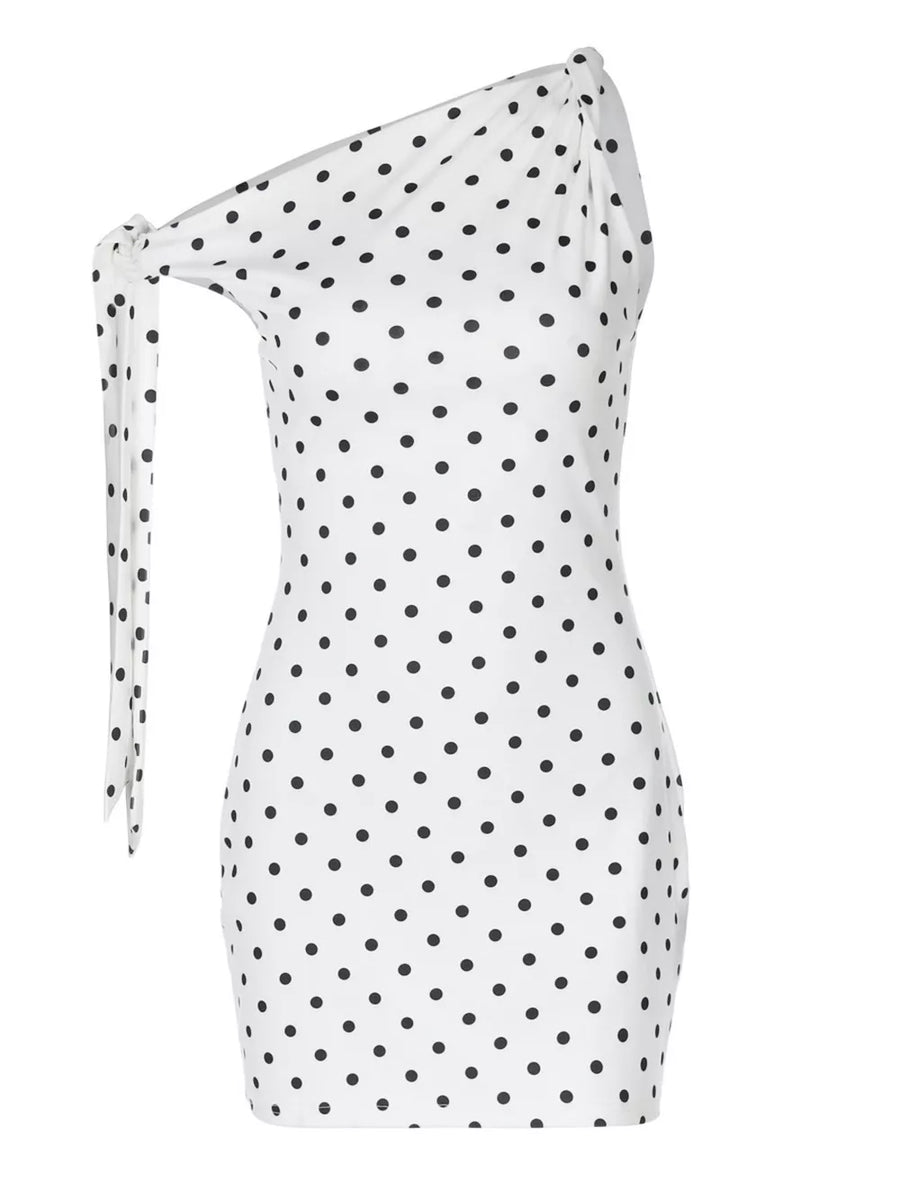 White polka dot mini dress with asymmetrical one-shoulder and bow detail