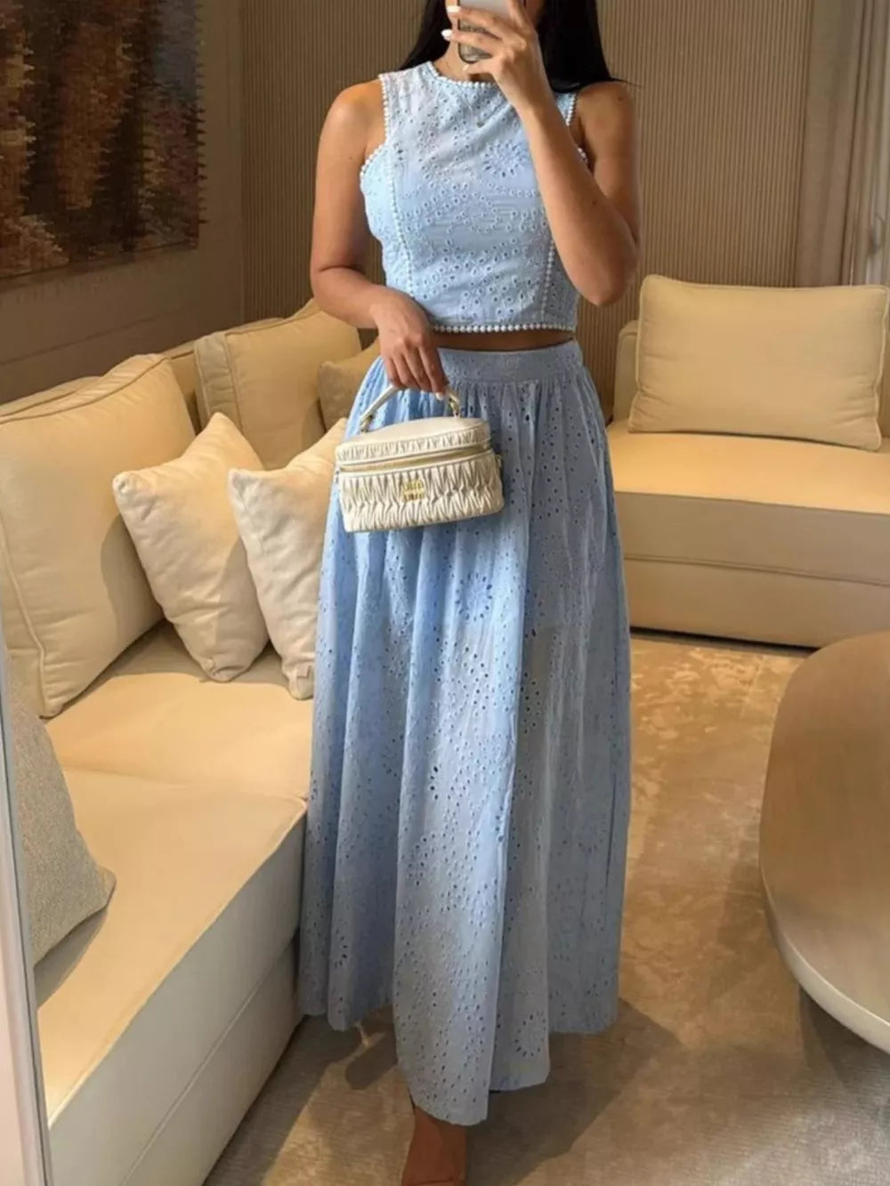 Light blue eyelet cropped top and maxi skirt set with pearl trim detail.