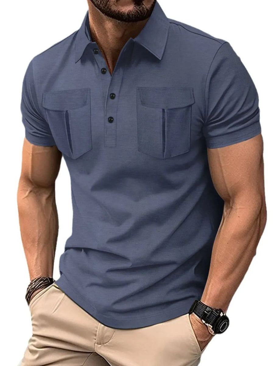 Dusty blue short sleeve polo shirt with two flap chest pockets and button placket.