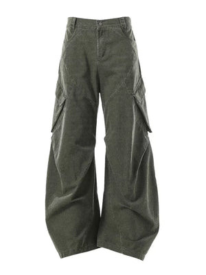 Textured paneled cargo pants in army green with a baggy fit and multiple pockets.