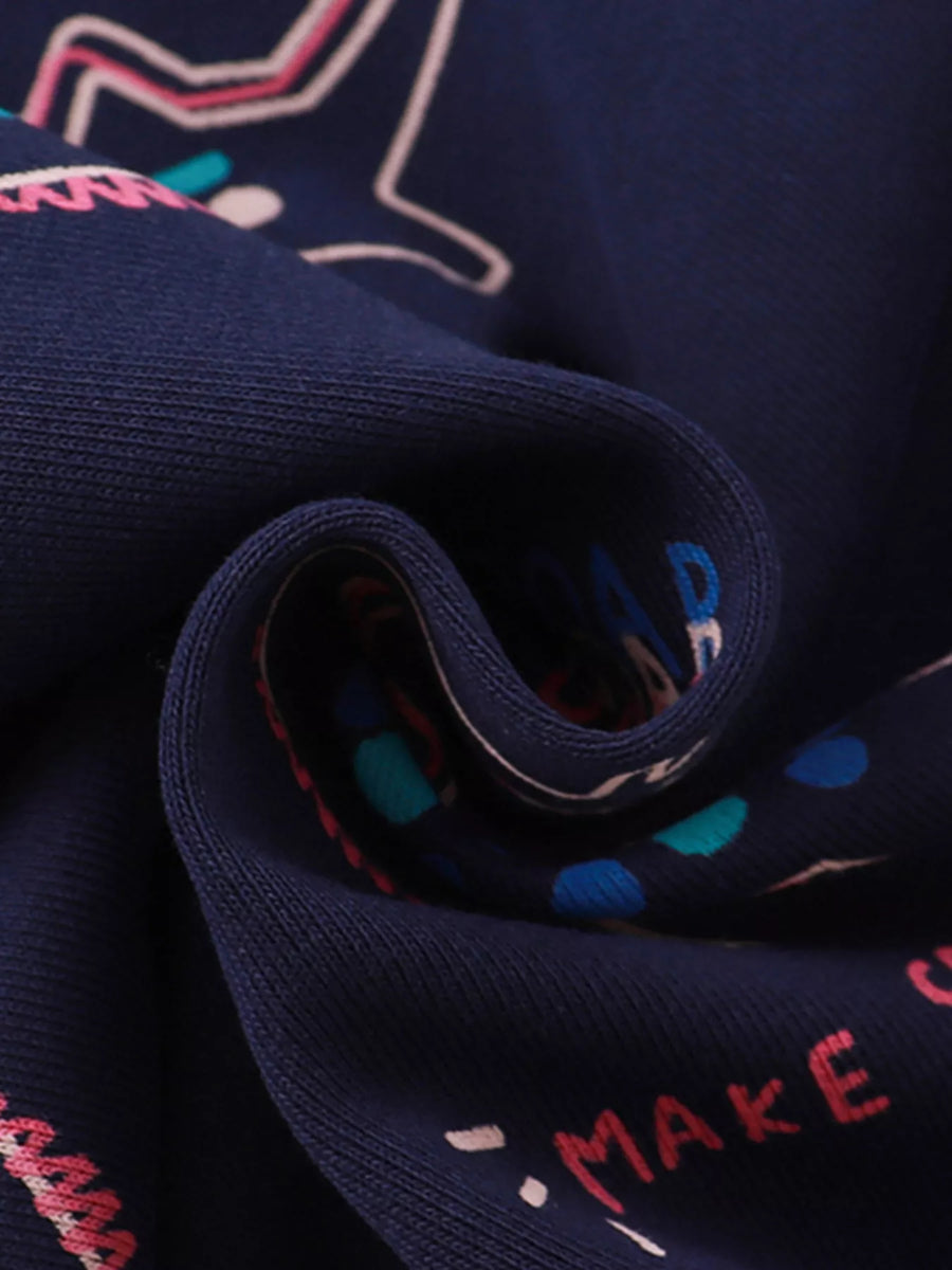Dark navy cotton sweatshirt with dinosaur print and ruffled detail.