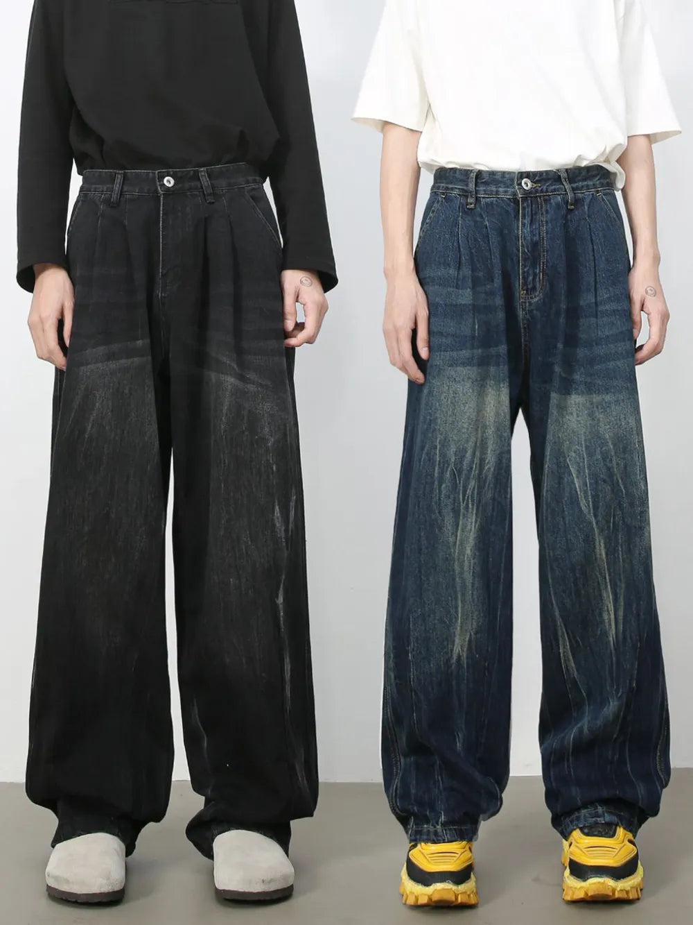 Pleated wide-leg distressed denim trousers in dark and medium wash, featuring a relaxed fit.