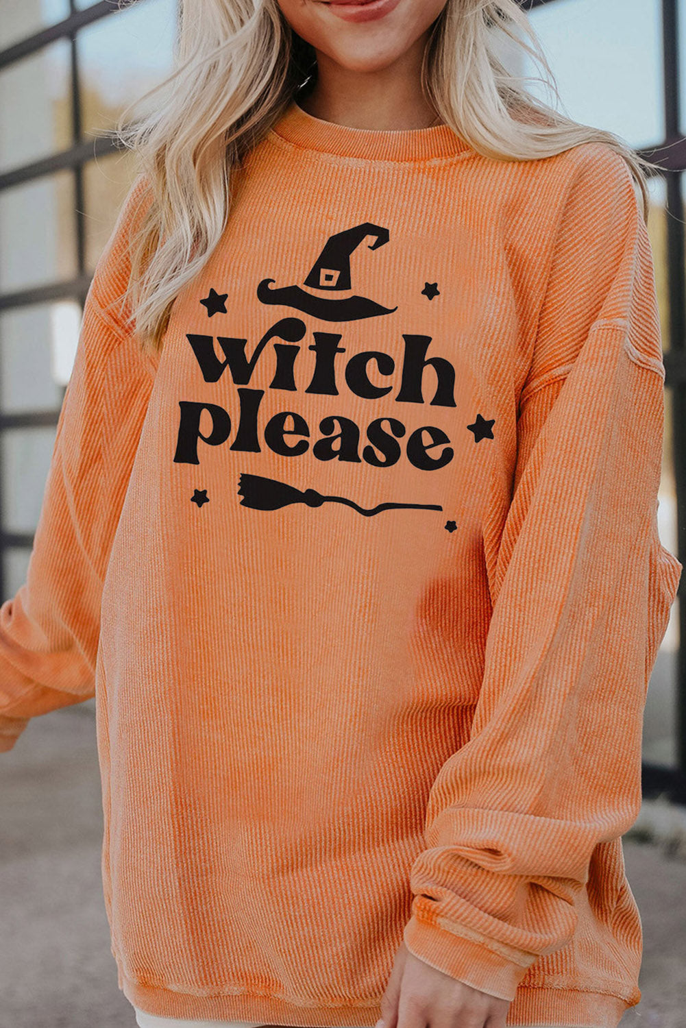 Corded sherbet sweatshirt with black Witch Please graphic and broom.