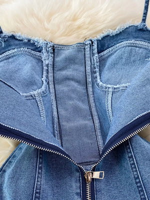 Blue denim corset dress with frayed hem and front zipper detail