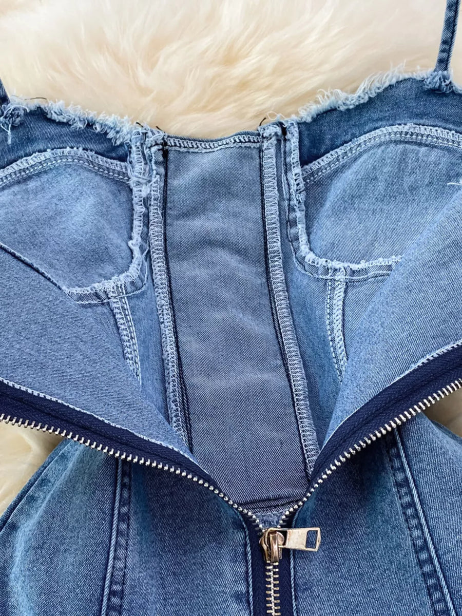 Blue denim corset dress with frayed hem and front zipper detail