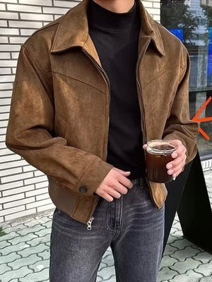 Brown suede zip-up casual jacket with a collar and button cuffs, worn by a man.