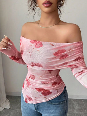Pink floral mesh off-shoulder top with ruched detailing and long sleeves.
