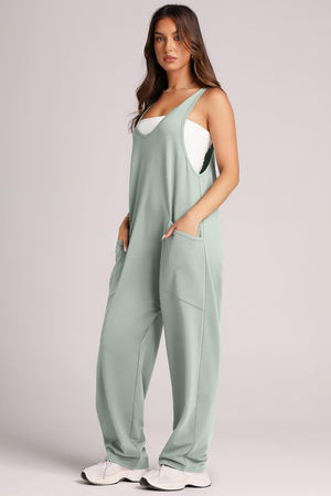 Relaxed fit jumpsuit in Matcha Green with oversized pockets and a V-neck.